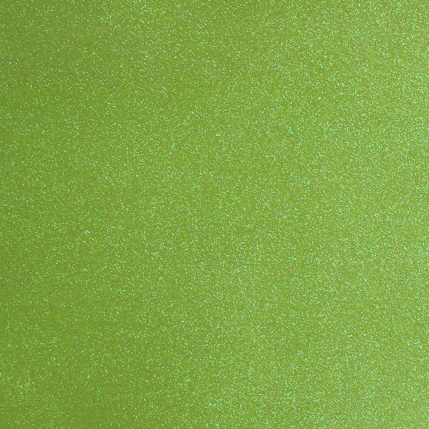 A close-up image of lime green glitter cardstock with a shimmering texture.