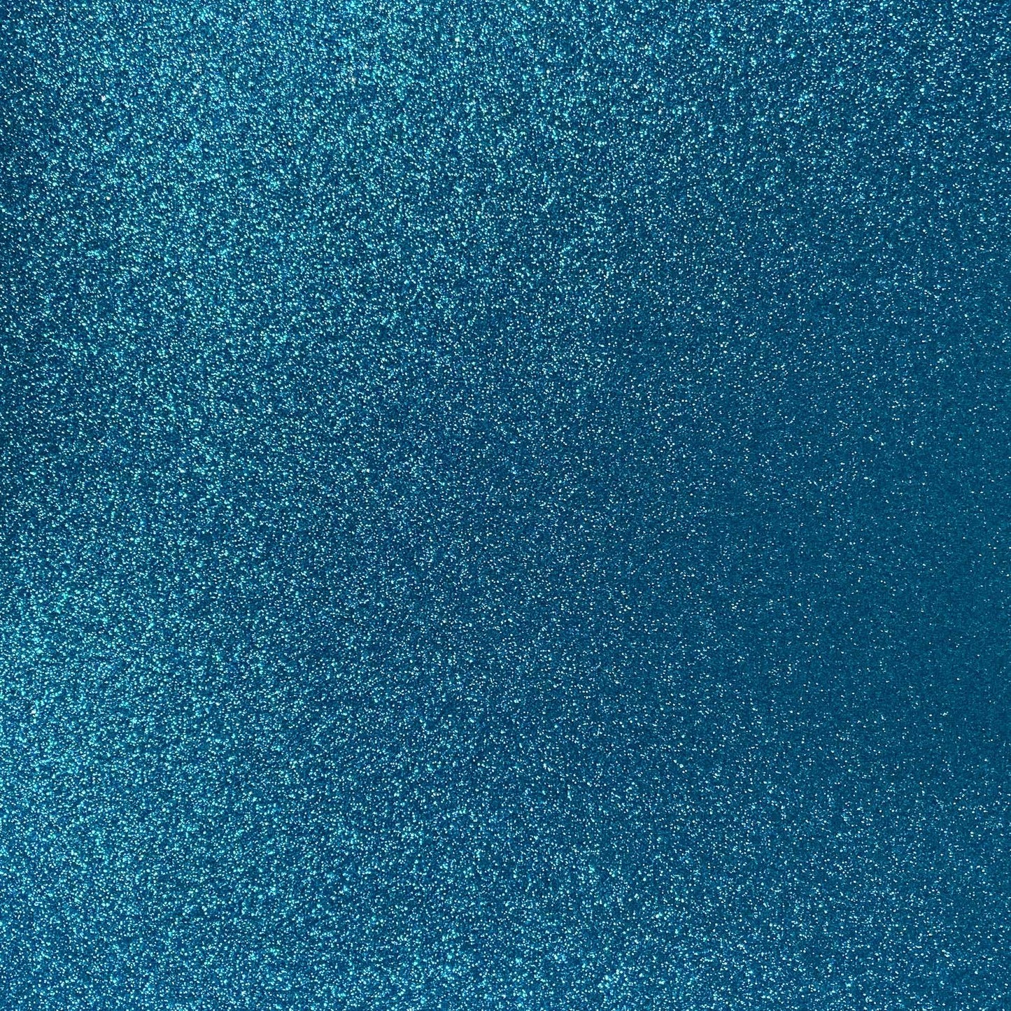 A close-up image of aqua blue glitter cardstock with a non-shedding glitter finish.