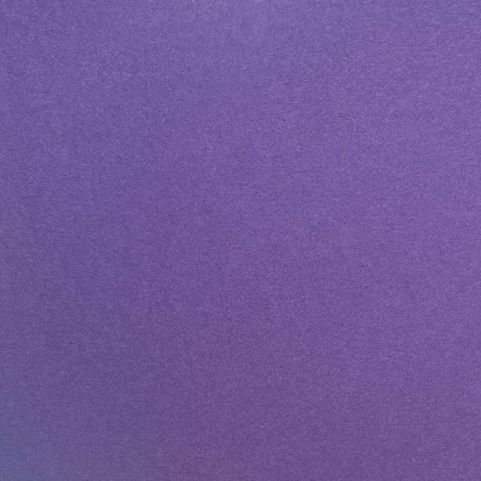 A single sheet of dark purple cardstock paper with a smooth finish.