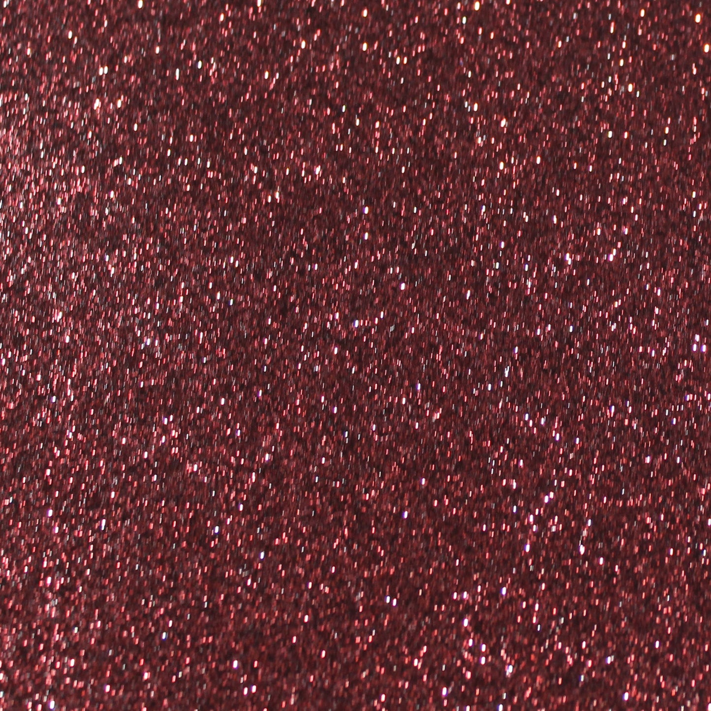 Close-up of dark red wine glitter cardstock with a shimmering texture.