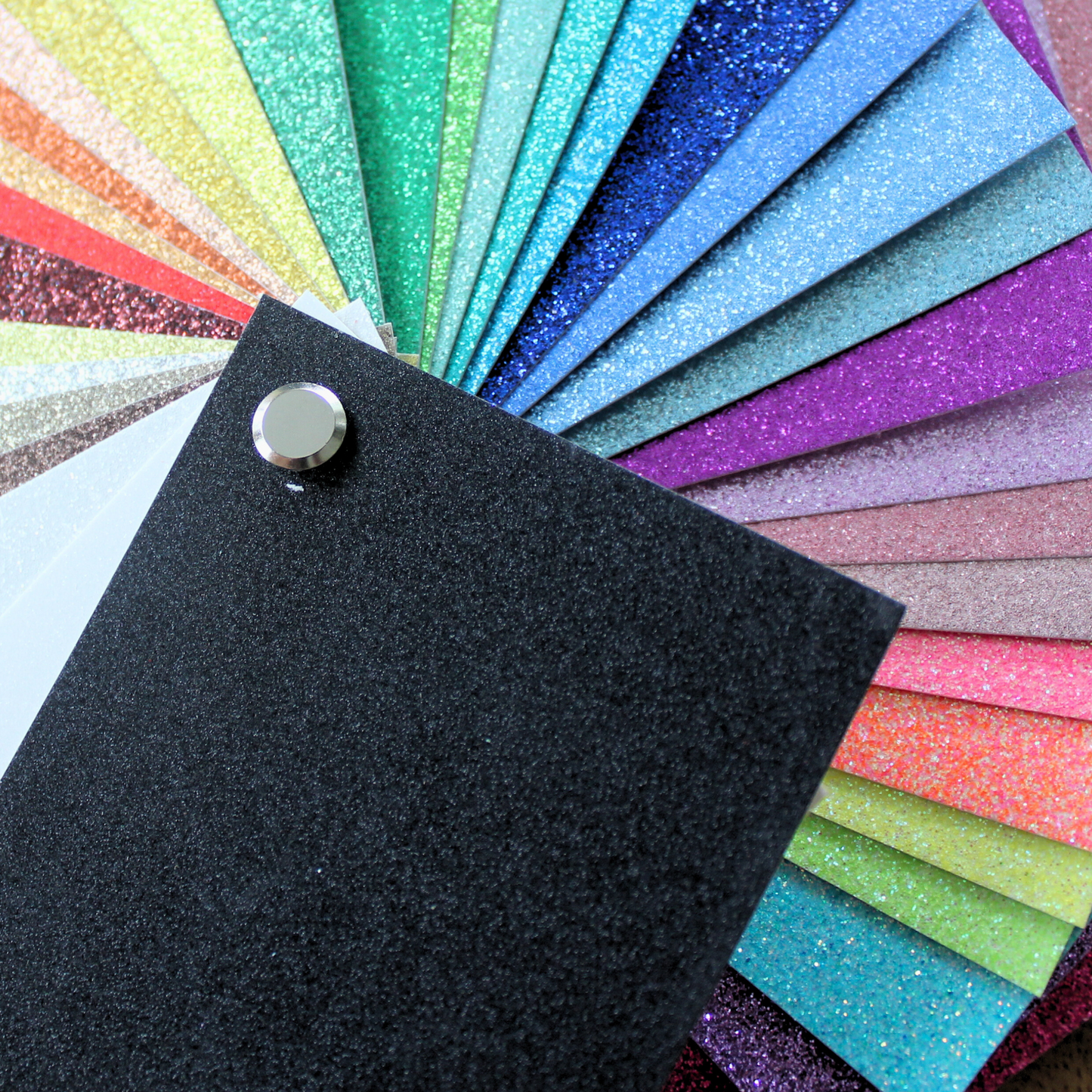 glitter cardstock swatch book Color swatch book with black page and colorful pages on a white background