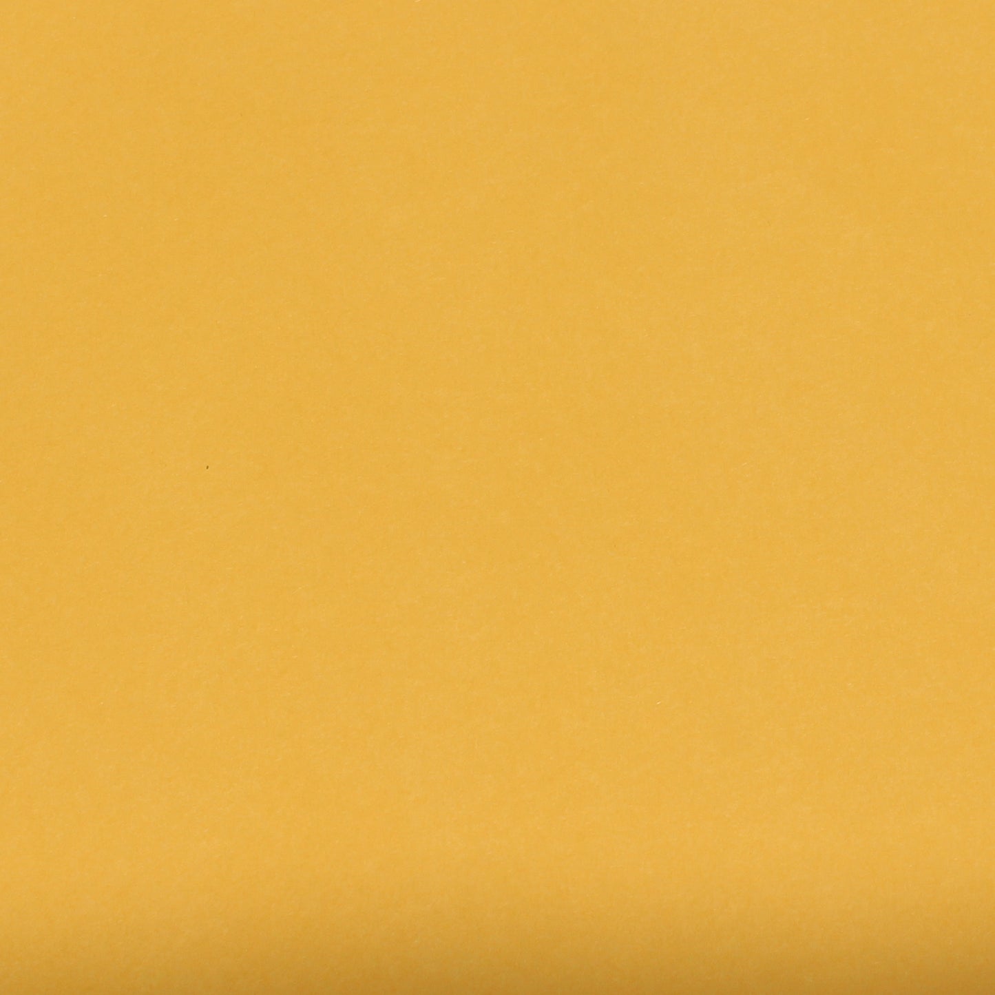A single sheet of goldenrod yellow cardstock paper with a smooth finish.
