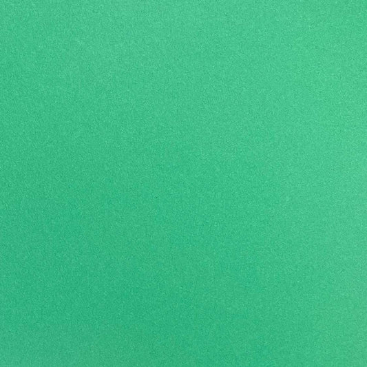 A single sheet of green cardstock paper with a smooth finish.