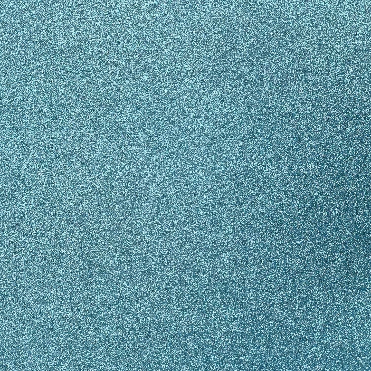 A close-up image of a light blue glitter cardstock paper.
