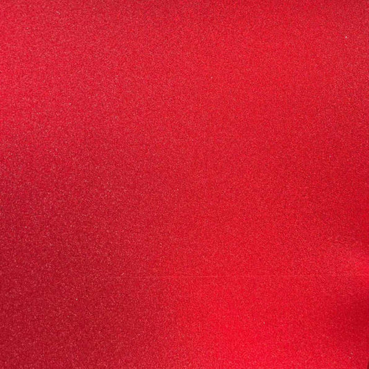 A close-up image of lipstick red glitter cardstock with a focus on its textured surface.