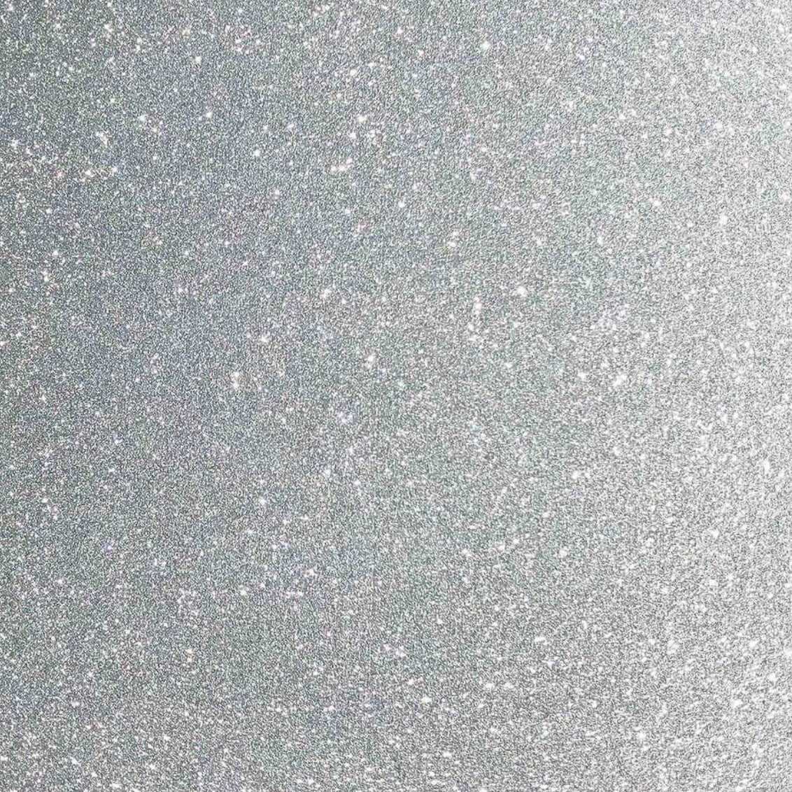 A close-up image of silver glitter cardstock showing the texture and glitter finish.