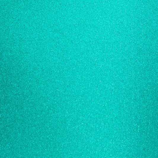 A close-up image of turquoise blue glitter cardstock with a shimmering texture.