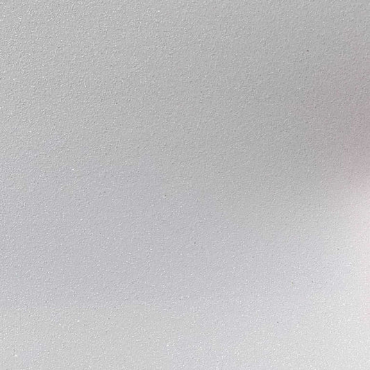 Close-up of a single sheet of white glitter cardstock paper.