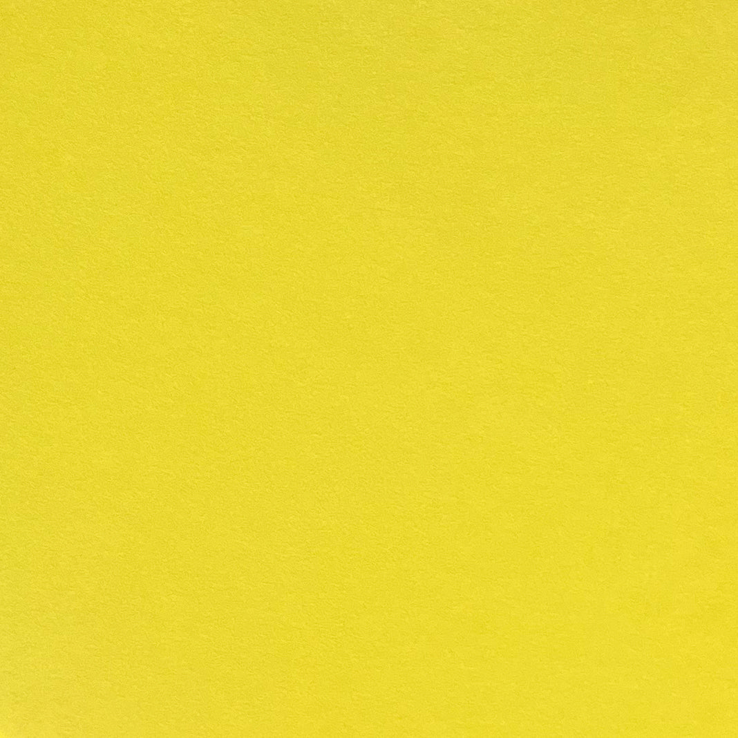 A single sheet of lemon yellow cardstock paper with a smooth finish.