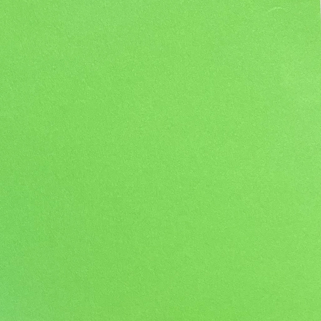 A single sheet of lime green cardstock paper with a smooth finish.