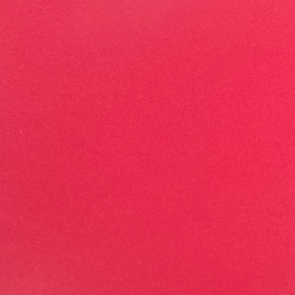A single sheet of red cardstock paper with a smooth finish.