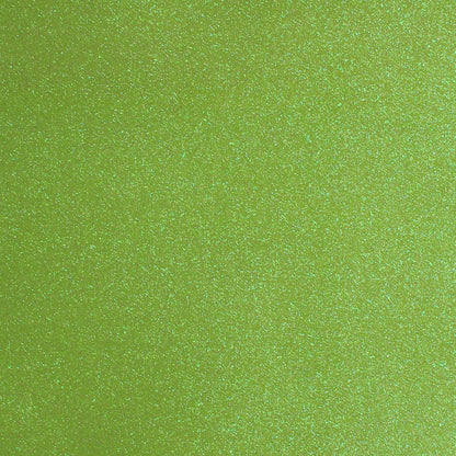 A close-up image of lime green glitter cardstock with a shimmering texture.