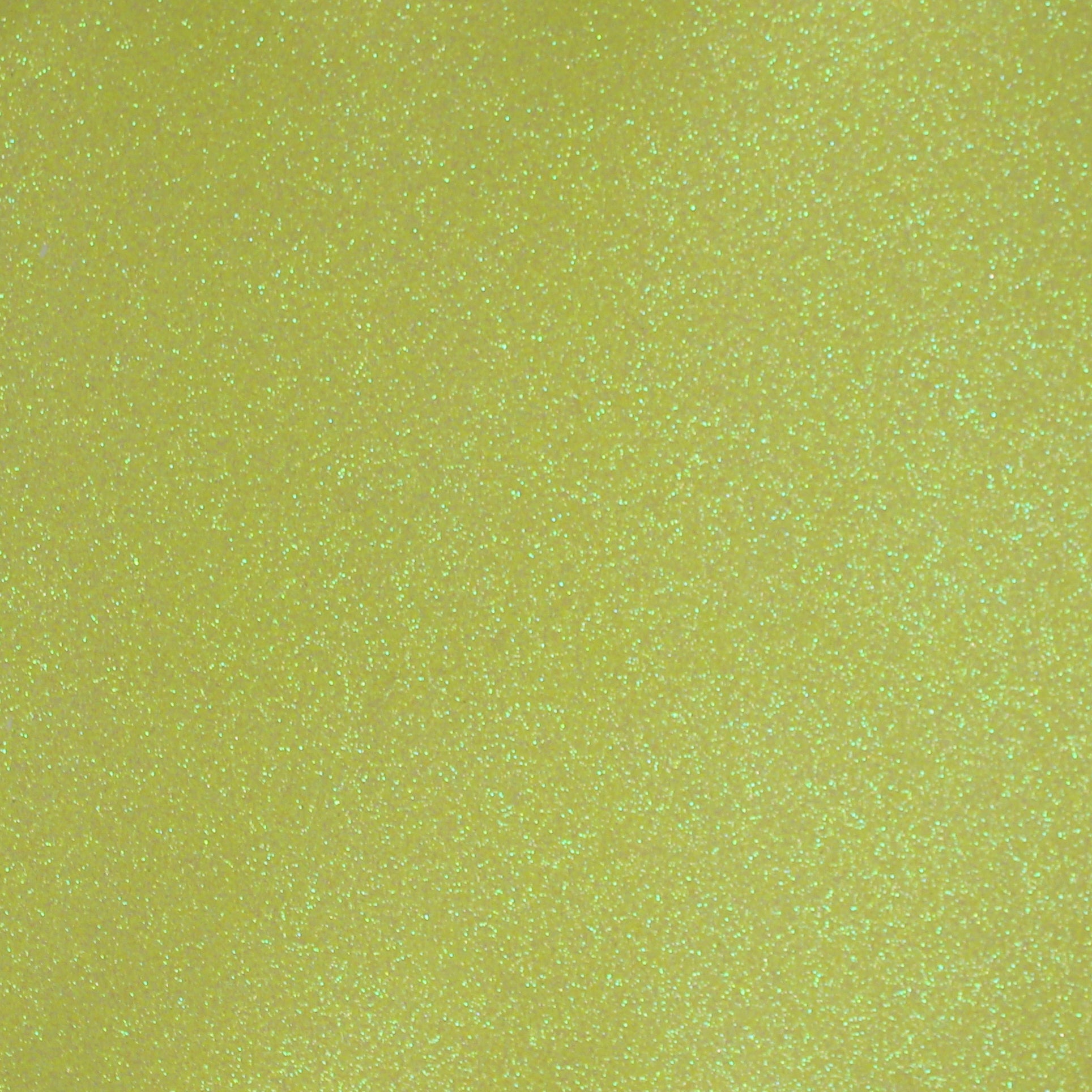 A close-up image of neon yellow glitter cardstock with a shimmering texture.