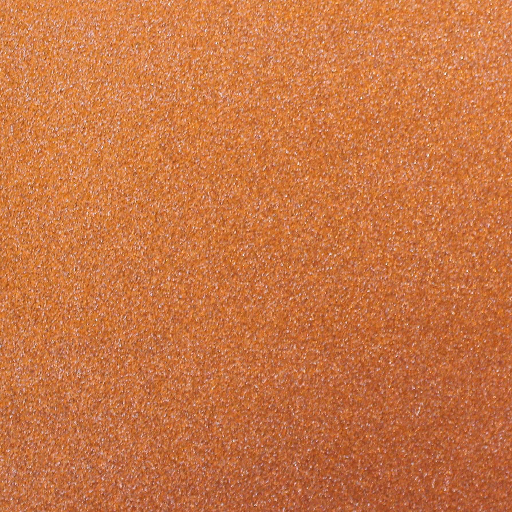 A close-up image of orange glitter cardstock with a non-shedding characteristic, showing the texture and glitter finish.