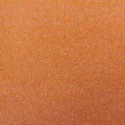 A close-up image of orange glitter cardstock with a non-shedding characteristic, showing the texture and glitter finish.