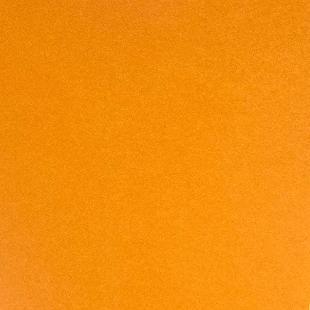A single sheet of apricot orange cardstock paper.