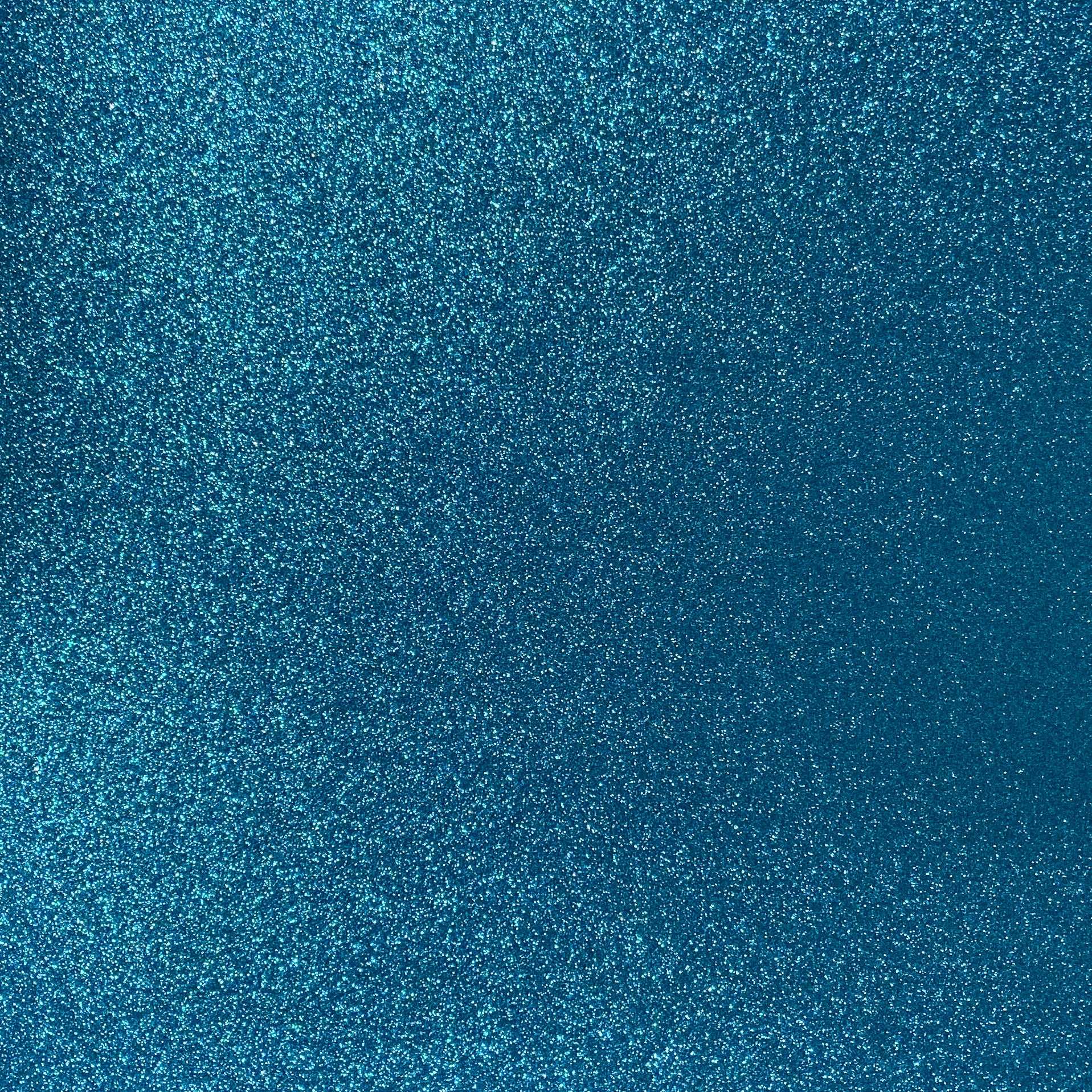 A close-up image of aqua blue glitter cardstock with a non-shedding glitter finish.