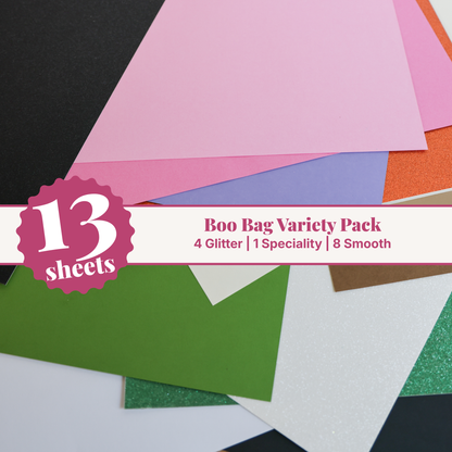 Boo Bag cardstock variety pack, 13 fanned 12x12 sheets of Halloween glitter, mirror silver, and smooth cardstock