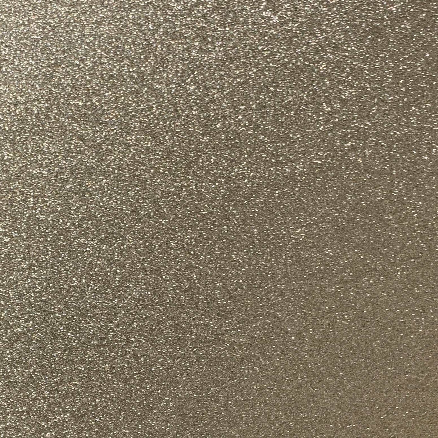 Close-up of champagne gold glitter cardstock with a shimmering finish.