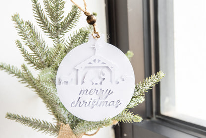 Personalized layered paper ornament with a nativity scene and merry Christmas cut from white cardstock