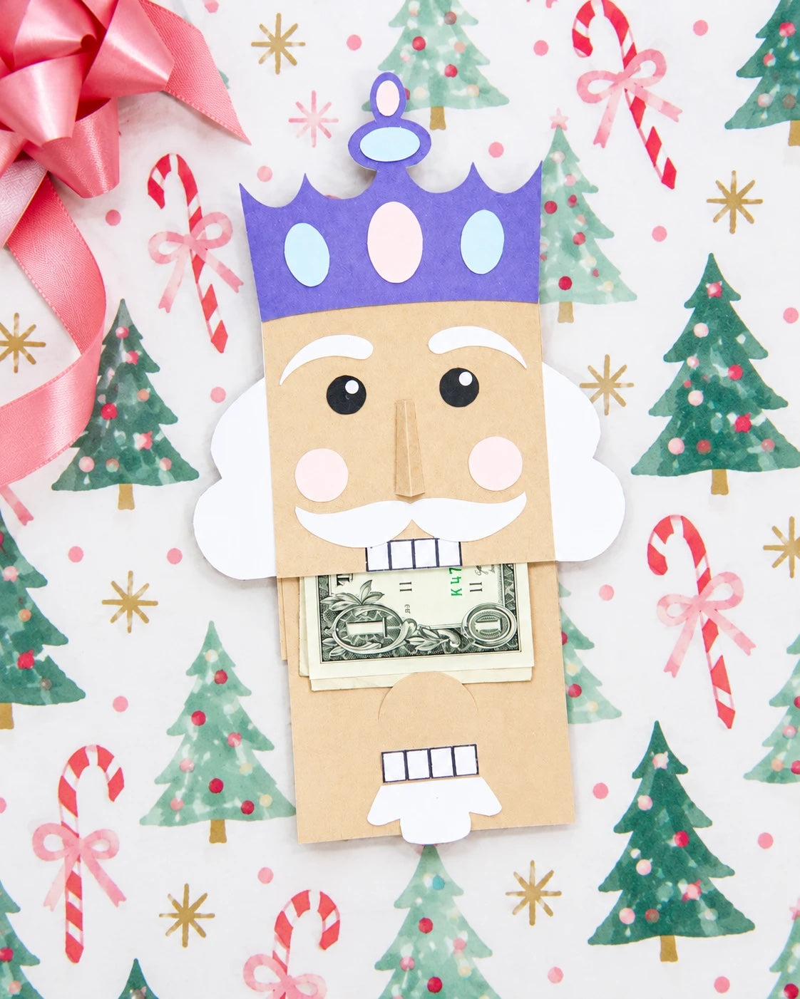 Nutcracker gift card holder made from kraft, electric purple, powder blue, light pink, and white cardstock