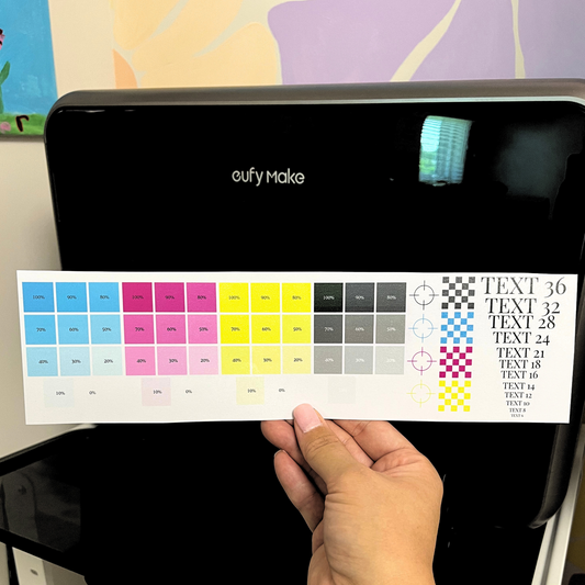 eufy Make uv printer with a color swatch held in front of it