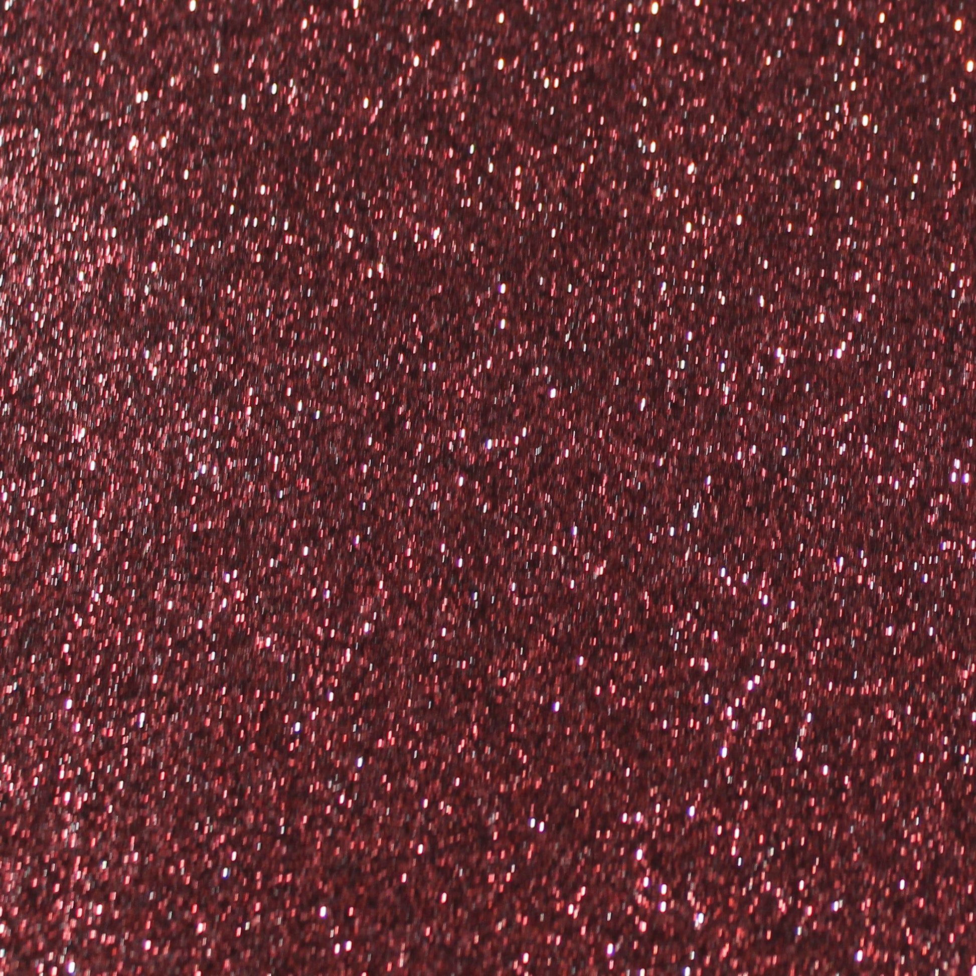 Close-up of dark red wine glitter cardstock with a shimmering texture.