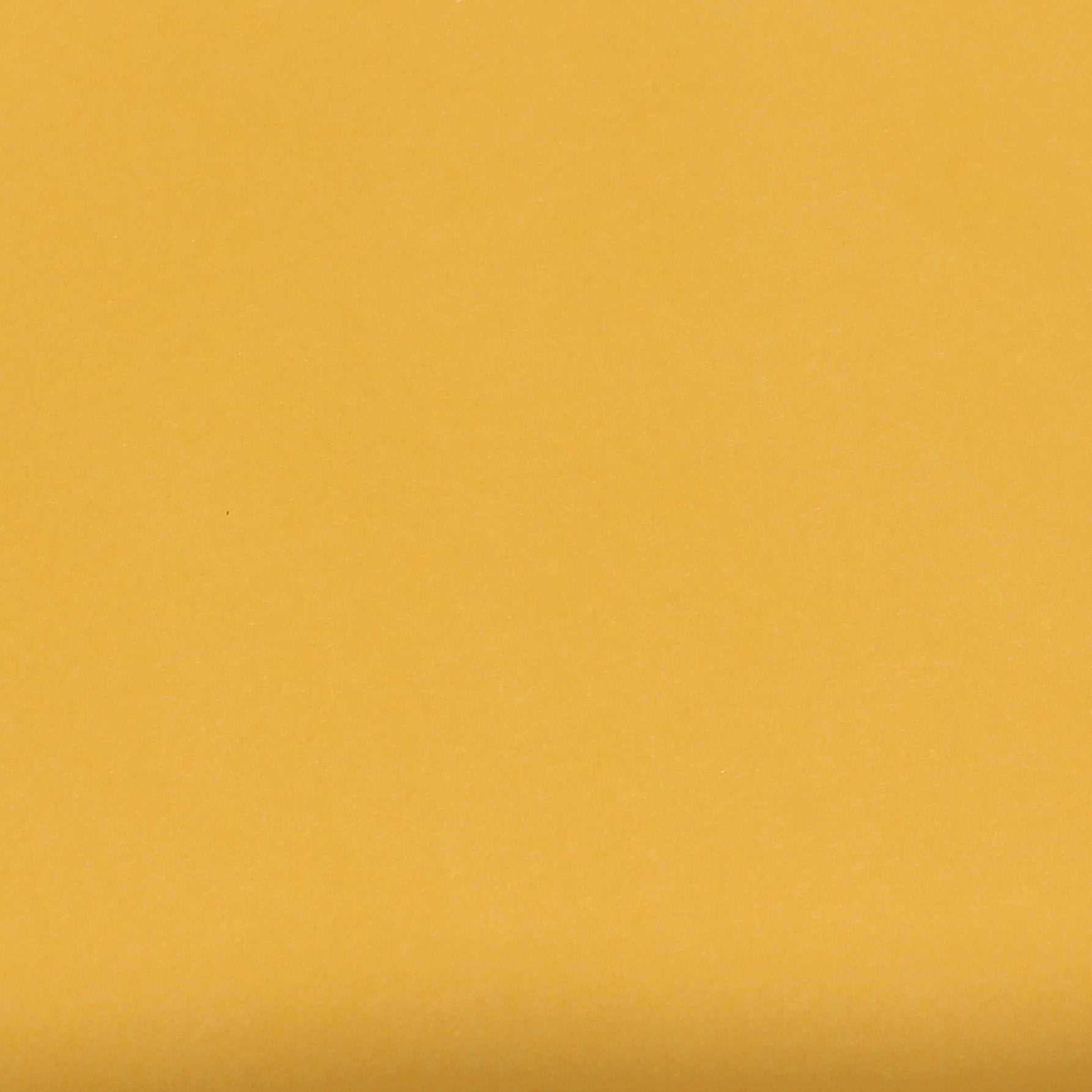 A single sheet of goldenrod yellow cardstock paper with a smooth finish.