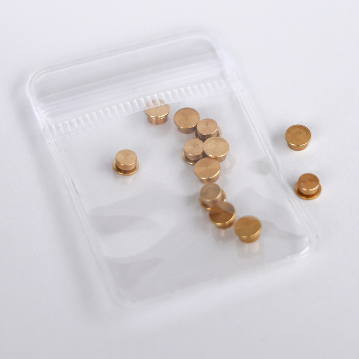 10 pack of gold metal cardstock spinners with a built-in bearing in a clear resealable bag, 5mm top and 4mm base