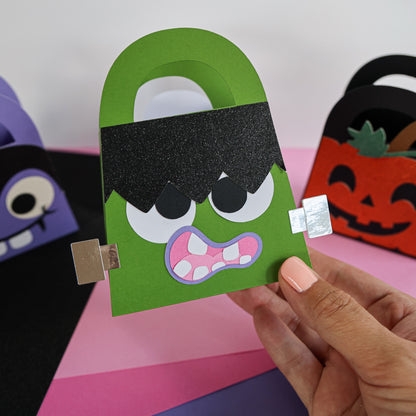 Green Frankenstein boo bag held in hand showing the finished Halloween treat bag size