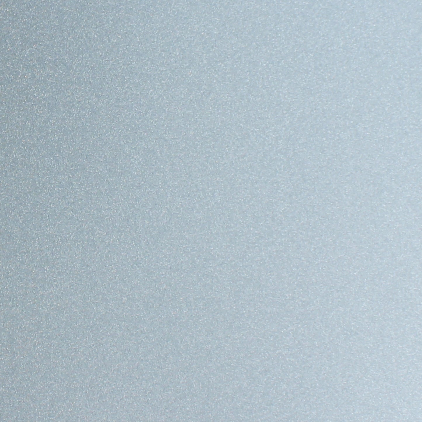 Icy blue glitter cardstock close-up with shimmering sparkle finish