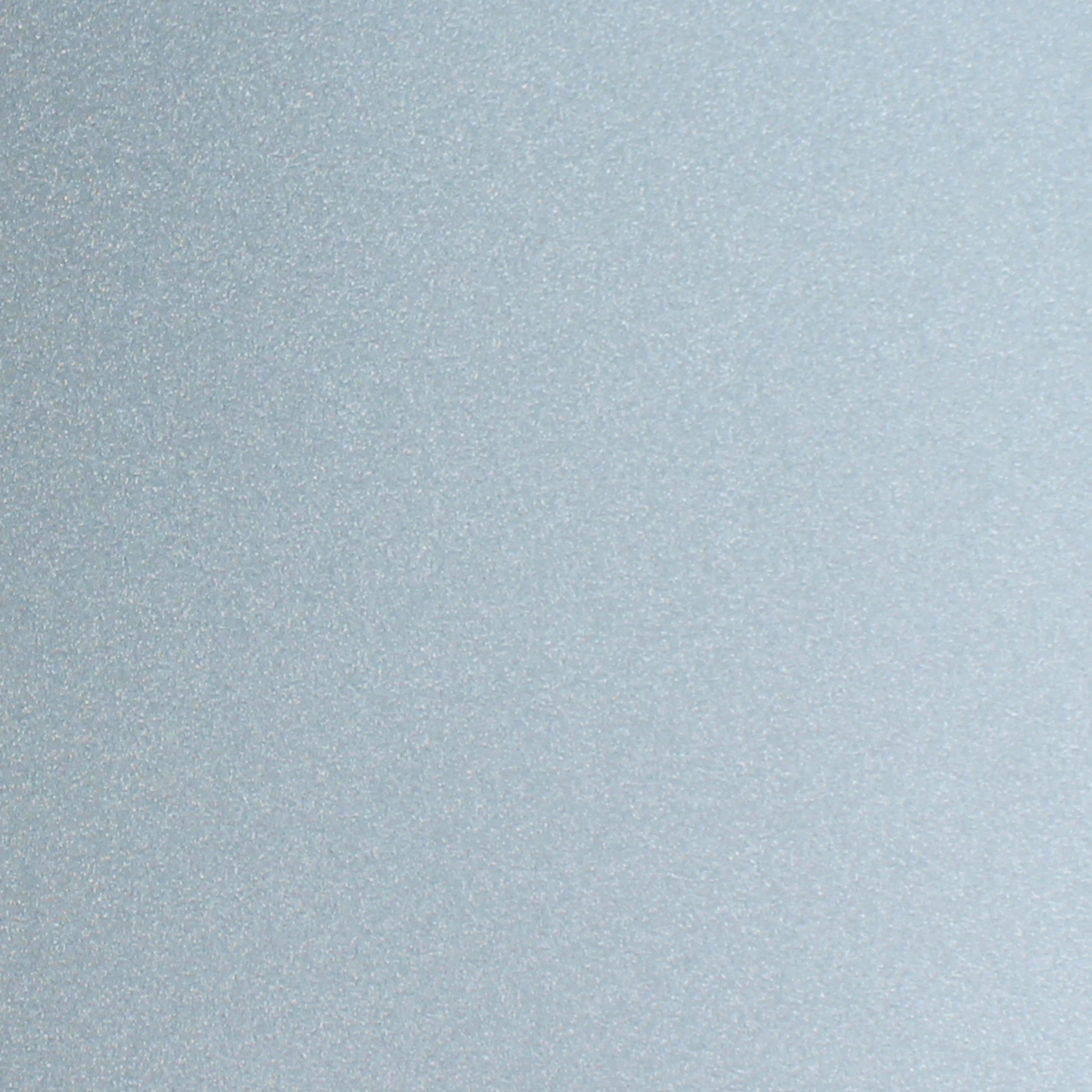 Icy blue glitter cardstock close-up with shimmering sparkle finish