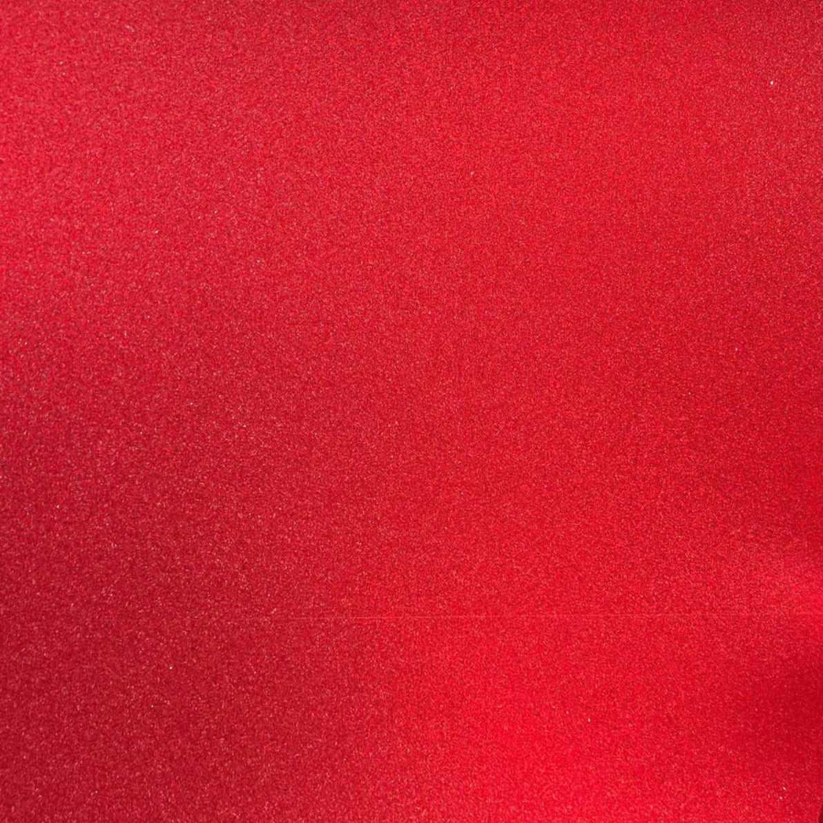 A close-up image of lipstick red glitter cardstock with a focus on its textured surface.