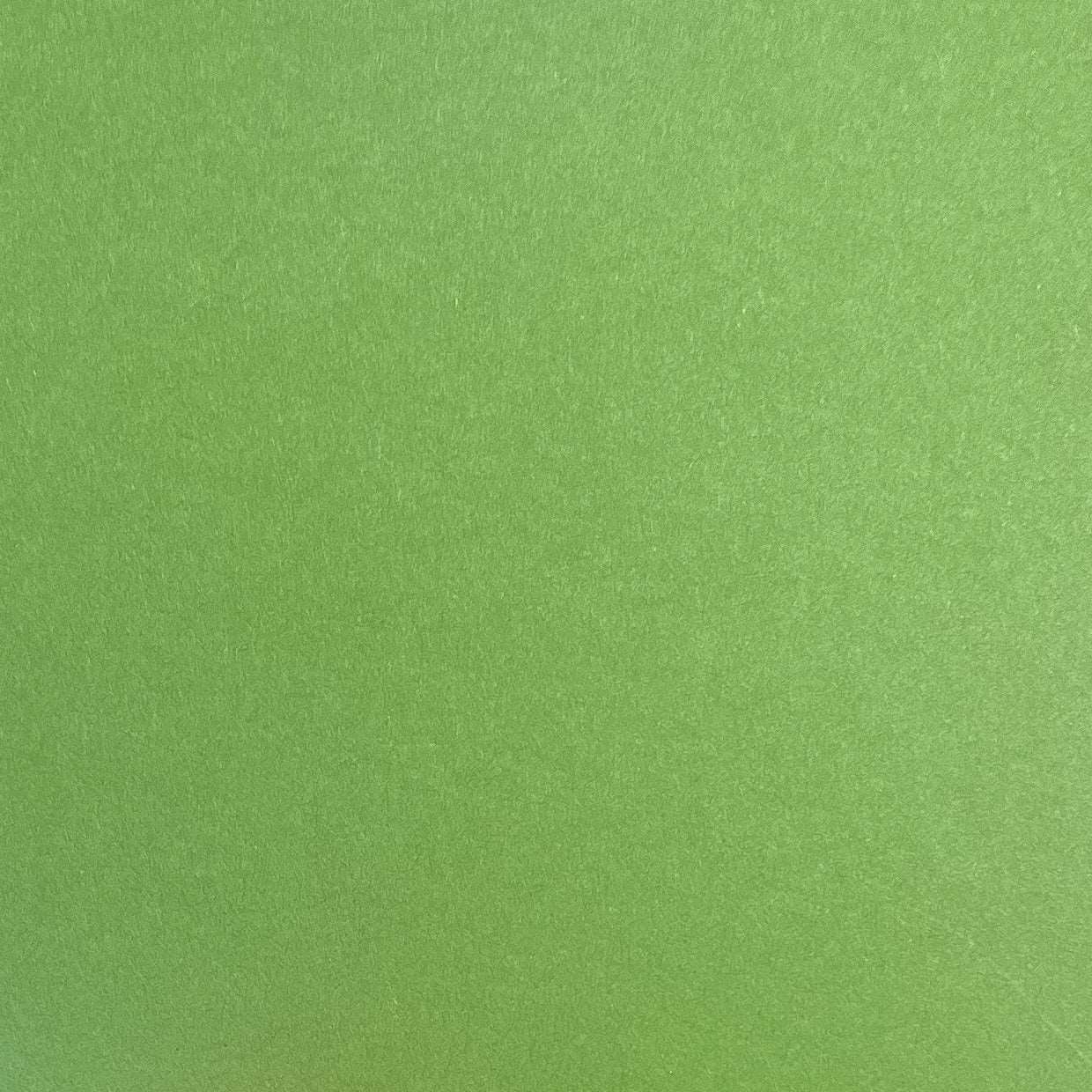 A single sheet of olive green cardstock paper with a smooth finish.