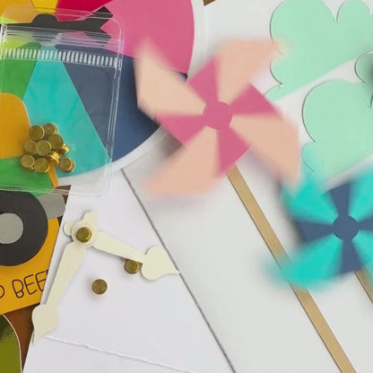 Video of gold cardstock spinners making paper pinwheels and cardstock clock hands spin on handmade cards