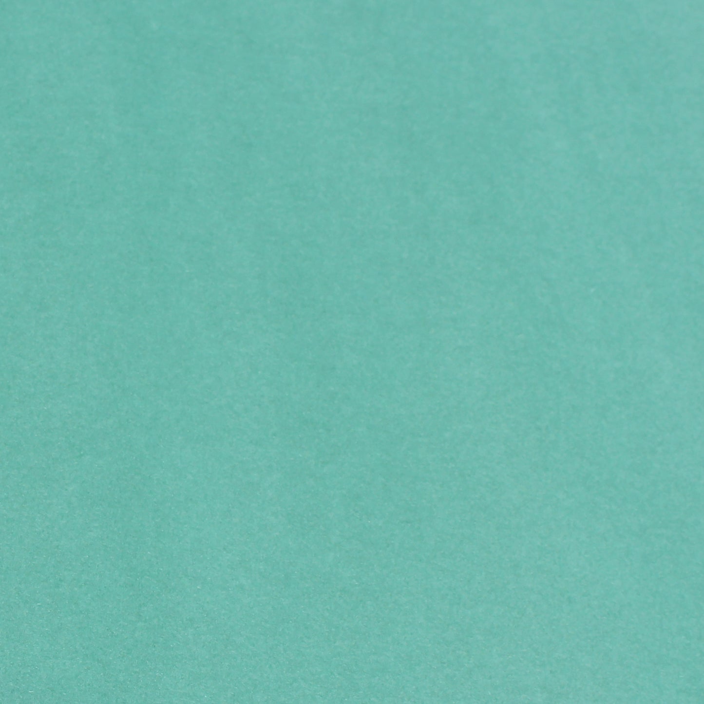 A single sheet of seafoam green cardstock paper with a smooth finish.
