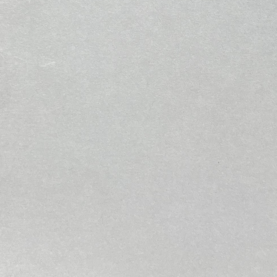 Close-up of light grey cardstock with a matte smooth finish