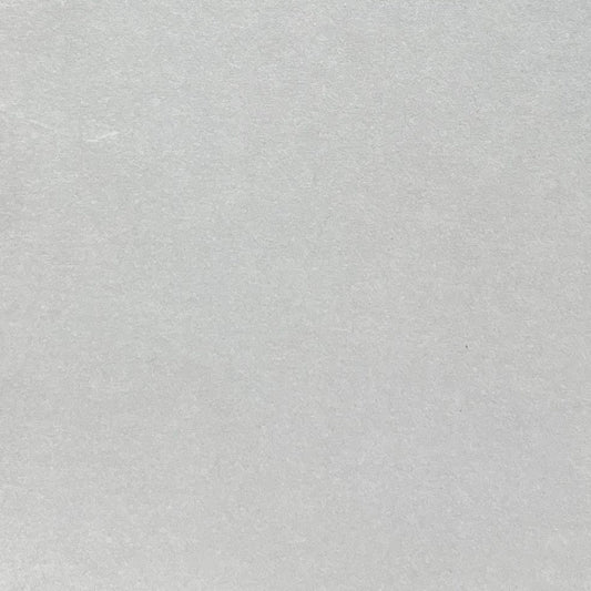 Close-up of light grey cardstock with a matte smooth finish