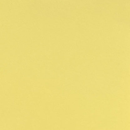 A single sheet of light yellow cardstock paper with a smooth finish.