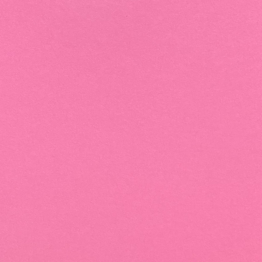 A single sheet of salmon pink cardstock paper.